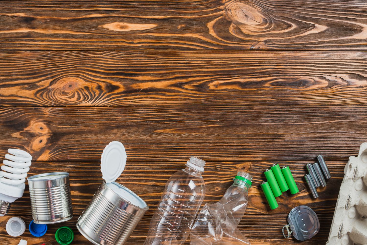 recycle-products-arranged-bottom-wooden-background.jpg